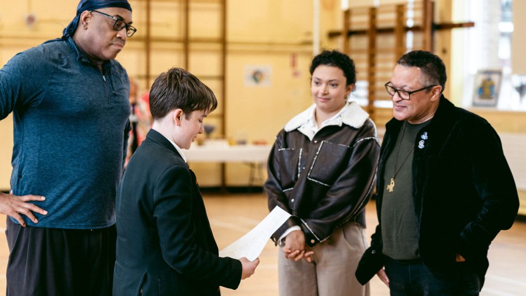 Douglass Family with Hamilton cast in school 